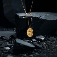 Connect with the sacred sound of the universe with our gold Om pendant, finely crafted in the USA. Representing the essence of ultimate reality, consciousness, and inner peace, each piece is a harmonious blend of spirituality and artistry. PENDANT INFORMATION This pendant is made of real, solid gold.• Made in USA• Material: 14k or 18k solid gold• Finish: polished• Height: 1.25" (31,5 mm) x Width: 0.84" (21 mm)• Pendant weight: approx. 6 grams (14k)• Bail: fits up to 4 mm chains• Solid back, not Ganesh Pendant, St Michael Pendant, St Christopher Pendant, Om Pendant, Phoenix Pendant, Gold Lion, Faith Jewelry, Gold Medallion, Gold Dragon