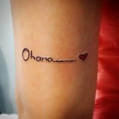 the word ohana is written in cursive writing with a heart on it