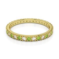 a pink gold ring with green and white stones