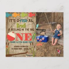 a little boy sitting on top of a wooden bench in front of a sign that says it's fishy brodi