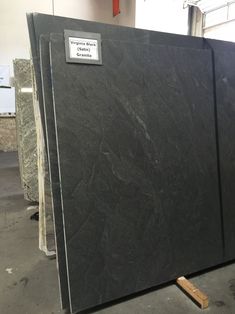 black marble is stacked up in a warehouse