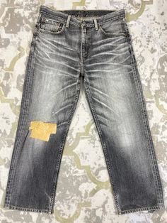 33x26.5 Distressed Grey Vintage Levi's 502 Jeans JN1412 Size: 33 Actual measurement (inches): Waist - 33 Front Rise - 11.5 Hips - 42 Thigh - 12.5 Knee - 9.5 Leg Opening - 17 Inseam - 26.5 Outseam - 37.5 Material : Cotton  *Disclaimer: Product color may slightly vary due to photographic lighting sources or your monitor settings.  #JN1412 Grunge Washed Denim Jeans, Faded Washed Cutoff Jeans, Vintage Distressed Dark Wash Jeans, Washed Black Cutoff Denim Jeans, Acid Wash Denim Grunge Jeans, Gray Distressed Straight Leg Jeans, Gray Distressed Denim Jeans, Washed Black Denim Cutoff Jeans, Gray Washed Grunge Jeans