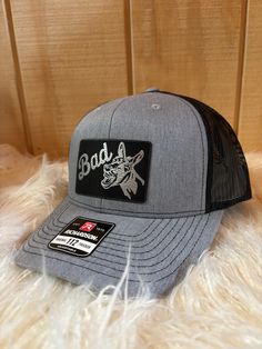 Guy's or Girl's choice: This hat comes in grey with black and pink with black. The design is engraved into the patch and not vinyl or any sort of sticker. The hat is adjustable snapback and the patch is vegan leather. Care Instructions: Machine wash Fabric: 50% Polyester, 25% Cotton and 25% Rayon 100% polyester mesh back Adjustable Gray Trucker Baseball Cap, Gray Trucker Snapback Hat With Curved Bill, Gray Snapback Fitted Hat For Streetwear, Gray Trucker Baseball Cap With Curved Bill, Gray Trucker Baseball Cap With Flat Bill, Gray Trucker Cap With Curved Bill, Gray Adjustable Trucker Hat With Curved Bill, Adjustable Gray Trucker Hat With Curved Bill, Gray Snapback Hat For Baseball Season