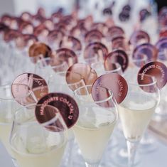 several glasses filled with different types of drinks