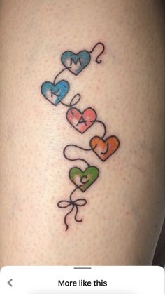 an image of a tattoo on the thigh that says love is in the air and hearts are