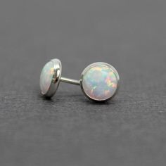 These opal stud earrings are beautiful.  They feature a single 6mm simulated opal cabochons.  Hand bezel set in my studio.  • 6mm Simulated Opal Round Cabochons• 14k Gold Filled or 925 Sterling SilverThey will arrive carefully packaged in a signature kraft gift box. Check out all of my opal earrings: https://www.etsy.com/shop/KMBankston/search?search_query=opal+earring&order=date_desc&view_type=gallery&ref=shop_search~About Me:My name is Kathy Bankston, and I am a metalsmith and lamp Adjustable Round Opal Jewelry, Hypoallergenic Round Opal Jewelry, Minimalist Ethiopian Opal Round Jewelry, Minimalist Opal Earrings, Dainty Round Ethiopian Opal Jewelry, Classic Opal Jewelry As A Gift, Classic Opal Jewelry For Gifts, Dainty Ethiopian Opal Round Jewelry, Classic Opal Cabochon Jewelry