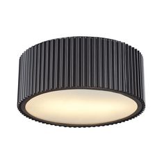 a black ceiling light that is on the wall