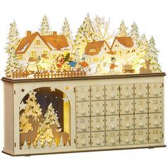 an illuminated christmas card box with trees and houses in the background, on a white background