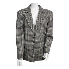 Gucci Houndstooth 1980’s Wool Blazer Jacket-Size 48 This 80’s houndstooth patterned throwback blazer is made from a very soft wool which almost feels like cashmere, 4 front buttons, 2 functioning slit pockets, 1 button with a partial cuff detail along the back of each sleeve, fully lined in a fabric with the word GUCCI throughout. This jacket is in excellent vintage condition. Jacket will come with its vintage green Gucci hanger as a plus! The measurements are as follows: Shoulder to Shoulder 18” Bust 44” waist 40” Hips 44” Sleeve length 24” Length from under collar 28” Green Gucci, Cuff Detail, Houndstooth Pattern, A Plus, Soft Wool, Wool Blazer, Blazer Jacket, Cashmere, Sleeve Length