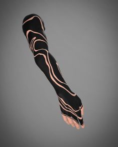 a hand with black and white designs on it