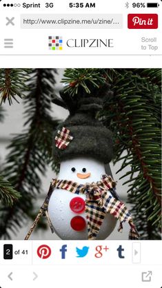 a snowman ornament hanging from a christmas tree with the wording on it