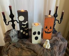 halloween candles and decorations on a table