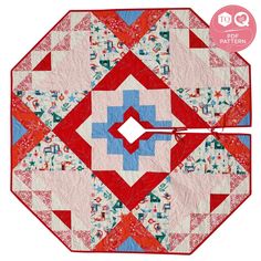 a red, white and blue quilted table topper with an arrow in the center