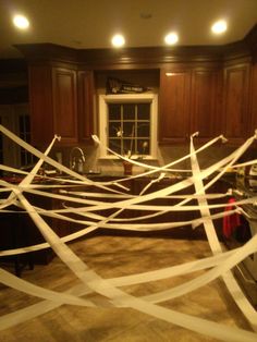 there are white tape wrapped around the kitchen counter