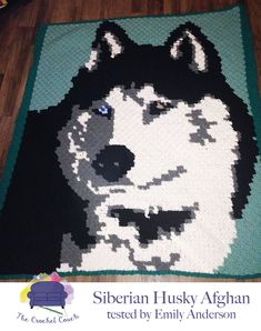 there is a crocheted husky rug on the floor