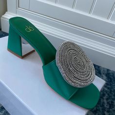 These Ola Satin Open-Back Dress Shoes Are A Show Stopper. In Emerald Green, They Have A 3" Heel And Are Brand New In Box With Wrapping. Sturdy Mule Construction With Dazzling Sequined Addition On The Front. Paired With A Black Dress, And Some Silver Or Diamond Jewelry, These Would Be Quite An Addition To Any Spring Wardrobe! Green Heels For Summer Events, Green Summer Event Heels, Green Round Toe Heels For Cocktail, Spring Green Embellished Heels, Green Rhinestone Round Toe Heels, Open Back Dresses, Spring Wardrobe, Dress And Heels, Mule Clogs