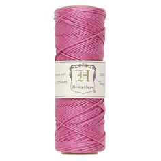 pink thread spools on a white background