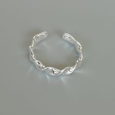 A free size sterling silver ring with pinched twits. SIZE: 1.5mm x 3.9 mm x 21.5 mm as sold ( It is open ended and can be adjusted to fit most fingers) WEIGHT: 2.42 gm This ring is made of 925 hypoallergenic sterling silver. Most of my pieces come with a 925 stamp. Can be packaged in a gift box. I can include a personal message from you if needed You are welcome to contact me at... bhavnakwintra1956@gmail.com For more beautiful pieces from my shop, please browse 👇 TOE RINGS: https://www.etsy.co Adjustable Silver Midi Rings With Modern Twist, Twist Ring Band, Twisted Band Ring, Twist Ring, Ring Minimalist, Open Ended, Unisex Ring, Bohemian Earrings, Gift Ring