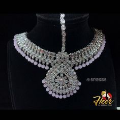 This bridal set is made up with rodium silver polish and gives up an excellent royal look. It comes with Choker, necklace, long haar, earrings, mathapati, Hath Panja, passa. For more designs or any query. Contact us : +91-9079290206 Royal Look, Silver Polish, Family Jewellery, Set Jewelry, Jhumka Earrings, Bridal Mehndi, Necklace Long, Wedding Jewellery, Wedding Jewelry Sets