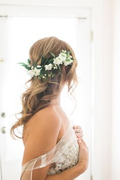 a woman wearing a flower crown on her head