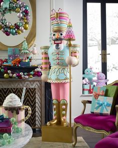 a large nutcracker statue sitting next to a christmas tree in a living room