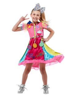 Your child will be feeling like a huge YouTube sensation this year when you pick up our Kids JoJo Siwa Costume. With this set, you will receive everything your kid needs to dance and sing and put out viral content like a pro! Featuring a gorgeous and eclectic red dress with a multi-colored skirt and colorful peppermint candy accents, as well as a big sparkly silver bow, your child is going to fall in love with this popstar look this year. Jojo Siwa Costume, Jojo Siwa Music Videos, Jojo Siwa Outfits, Pink And Green Dress, Pink Ombre Hair, Candy Costumes, Black Hair Bows, Pink Costume, Pink Hair Bows