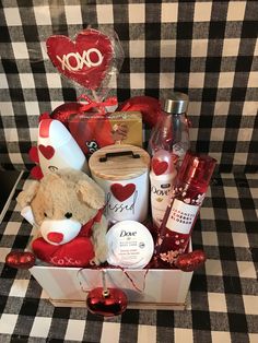 a valentine's day gift box with a teddy bear, soaps and lotion