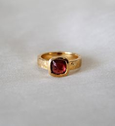 D E T A I L S - Stone: Garnet Stone Shape: Pyramid Material: Sterling silver The fit: True to US ring size Finish: Hammered and Gold Plated to a high shine S H I P P I N G & P R O D U C T I O N - My current production time is 2-6 business days, which means after those days are up, your order ships! I make everything custom to order, by hand, but I promise you it's worth the wait! R U S H - M Y - O R D E R - If you're in a rush to get your pretty new pieces, please send me a message and I'll Heirloom Crystal Ring With Accent Stones As Gift, Unique Bezel Setting Rings As Gift, Unique Rings With Bezel Setting For Gift, Unique Rings With Bezel Setting As Gift, Blue Topaz Ring For Gift, Heirloom Crystal Ring With Accent Stones For Gift, Ruby Open Ring With Bezel Setting As A Gift, Gift Ruby Ring With Bezel Setting In Open Design, Gift Ruby Open Ring With Bezel Setting