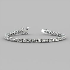 Spoil yourself or that someone special with this divine bracelet. Stunningly classic, 49 round cut Simulated Diamonds with a total weight of 8.67CTW radiate beautifully within a classic 4-prong setting. Enclosed by a box clasp to ensure your precious piece is always secure, this tennis bracelet is the perfect touch to any look.    8.67CTW Classic Round Cut Tennis Bracelet;  Stone Clarity: VVS-1;  Available in:14K White or Yellow Gold;  Length: 7 inches;  Model: B3557A; Bracelet Stone, Ankle Chain, Halo Earrings, Weird Stuff, Spoil Yourself, Box Clasp, Free Earrings, Someone Special, Solitaire Pendant