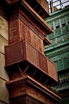 an old building with wooden balconies on it