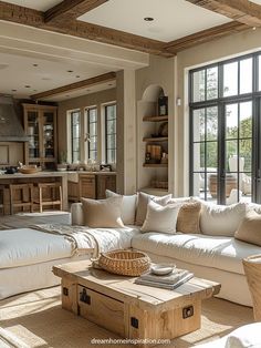 a living room filled with furniture and windows