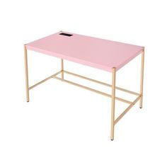 a pink table with gold legs and a black square hole in the middle on an isolated white background