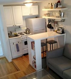 the small kitchen is clean and ready to be used as a living room or office