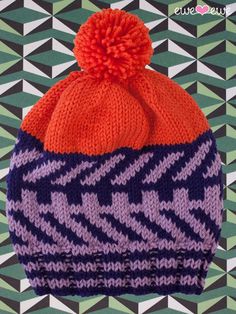 a knitted hat with an orange and purple pom - pom on top