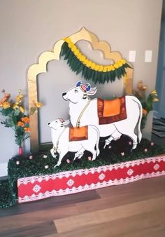 a decorated horse and dog on display in a room