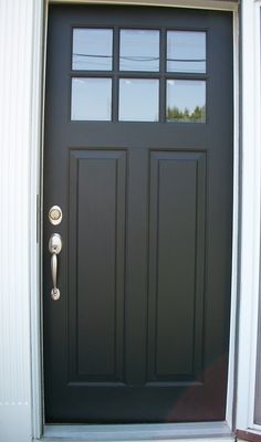 a black front door with two sidelights