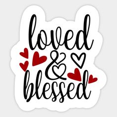 a sticker that says loved and kissed with hearts in black ink on a white background