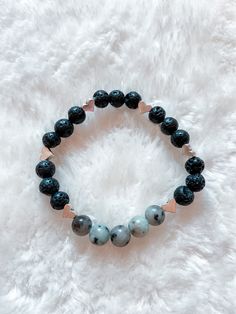 This lava rock diffuser bracelet features semi-precious light blue stones, with metal heart-shaped accent beads. Simply place a few drops of essential oil on the lava rocks, allow it to dry, and gently slide it over your wrist to use! This bracelet is stretchy. The lava rocks will hold oil for approx. 24-48 hours. Reapply oil as needed! Hippie Bracelets, Blue Stones, Diffuser Bracelets, Metal Heart, Lava Rock, Tie Styles, Blue Stone, Semiprecious Stones, Precious Stones