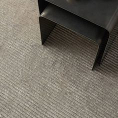 a coffee table sitting on top of a carpeted floor