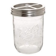 a glass mason jar with a metal lid