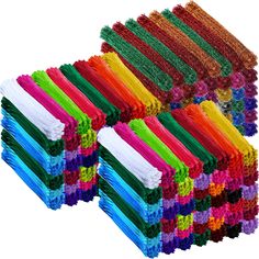 a bunch of different colored pieces of yarn on top of each other, all stacked together