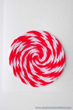 a red and white lollipop candy cane