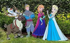 three cardboard cutouts of frozen princesses and their reindeers are standing in front of some bushes