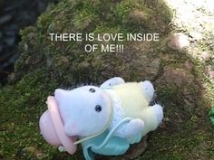 there is love inside of me teddy bear on the mossy ground with text overlay