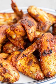 grilled chicken wings on a white and blue plate