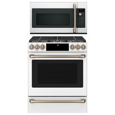 two white ovens side by side with gold handles