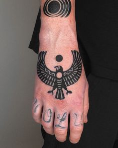 a person with a tattoo on their hand and the numbers 2013 written in black ink