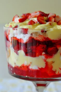 a trifle with strawberries and whipped cream on top