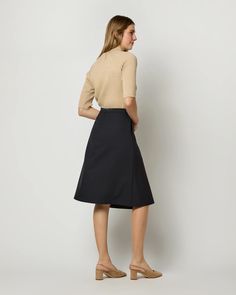 Preston Skirt in Ink Tropical Wool | Shop Ann Mashburn Classic Fitted A-line Skirt, Asymmetrical Pleated Skirt For Work, Knee-length Relaxed Skirt For Work, Fall Asymmetrical Lined Pencil Skirt, Fall Formal Knee-length Skirt, Fitted A-line Skirt For Workwear, Formal Knee-length Skirt For Fall, Formal Knee-length Mini Skirt For Fall, Asymmetrical Pleated Office Skirt