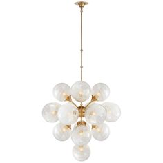 a large chandelier with glass balls hanging from it's brass finish frame